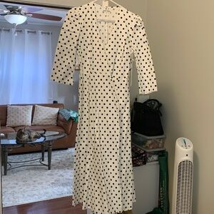 A beautiful white with black polka dots wrap dress never worn.